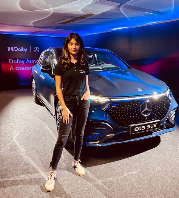 Event hostess at the Dolby booth in front of the Mercedes at Sonar